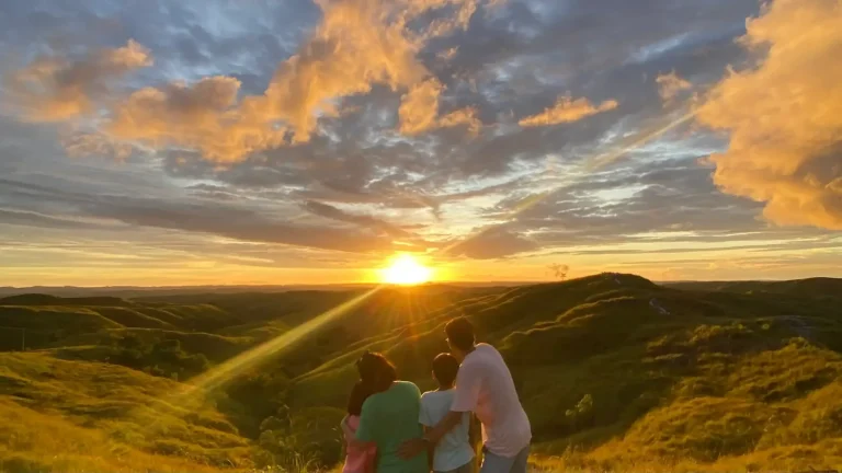 Family at sunset on a Sumba hill
