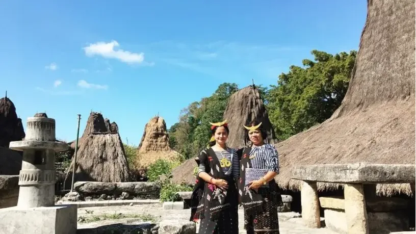 Travellers in traditional West Sumba dress at a village